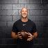 Image of Ambassador Ricky Proehl holding a football